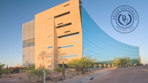Modern Bryan University Resource Center building with glass facade and desert landscaping, ideal as a Zoom background for professional or educational virtual meetings.