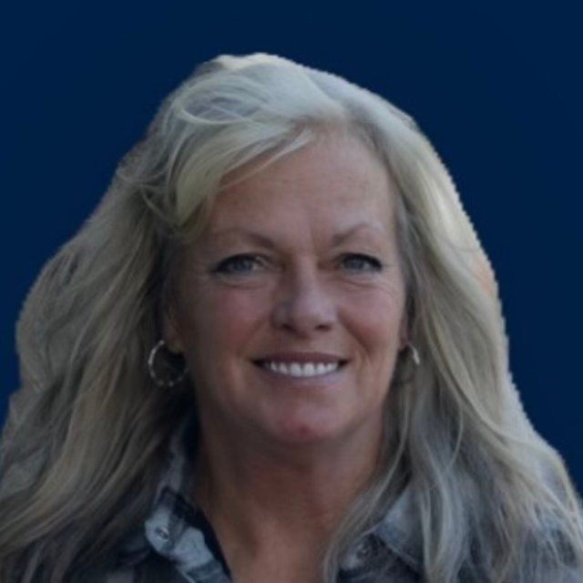 Image of a professional woman smiling, representing career counseling services at BU Resource Center, part of Bryan University.