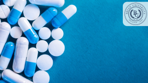 Bright blue pills and tablets scattered on a blue background, ideal for virtual meetings and presentations related to healthcare, medicine, or pharmacy.