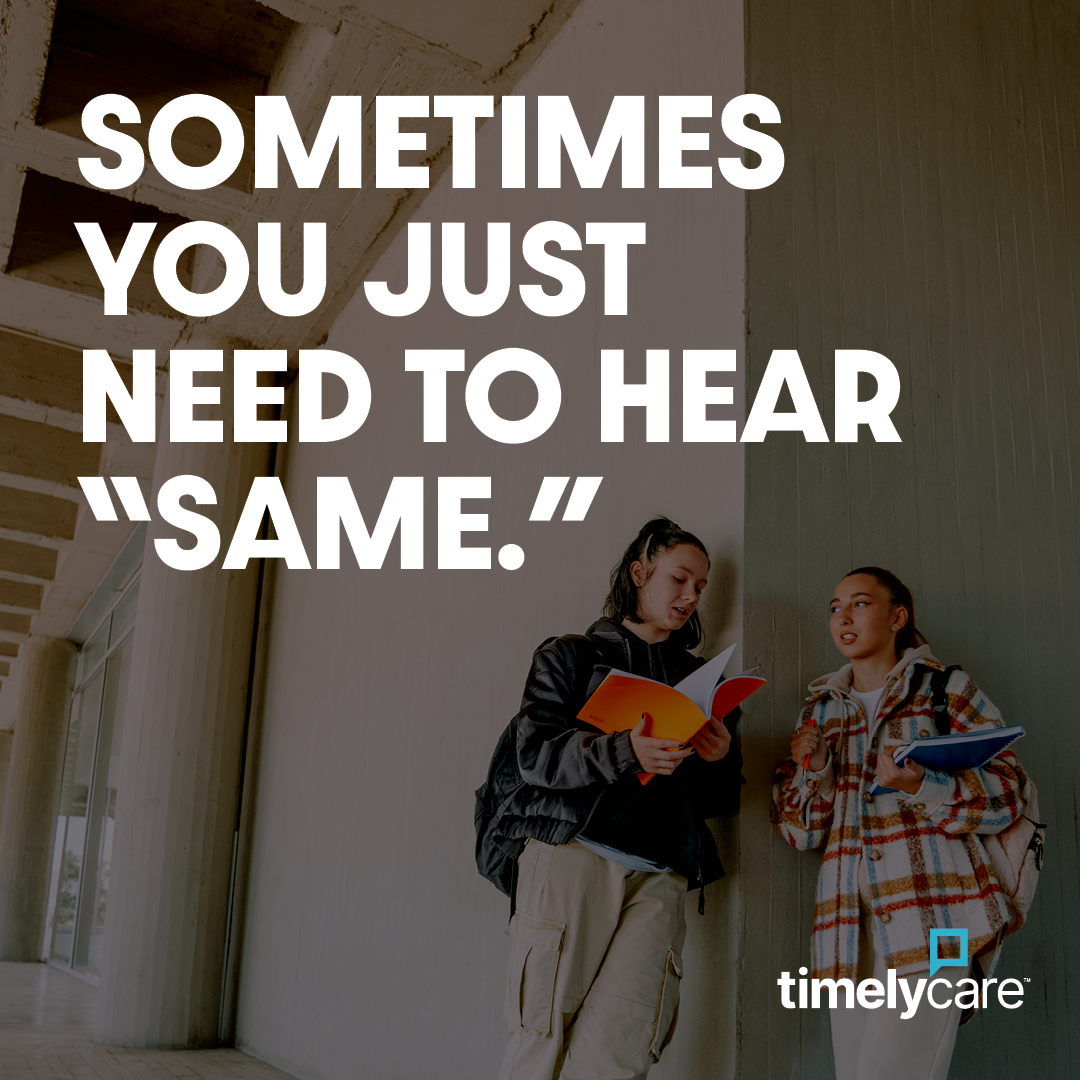 Two women standing in a hallway holding books with the white text sometimes you just need to hear same.