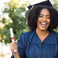 female graduate with diploma