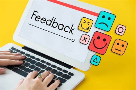 Image showing feedback icons and a laptop with the word "Feedback" on the screen, emphasizing the importance of constructive feedback in academic and professional settings.