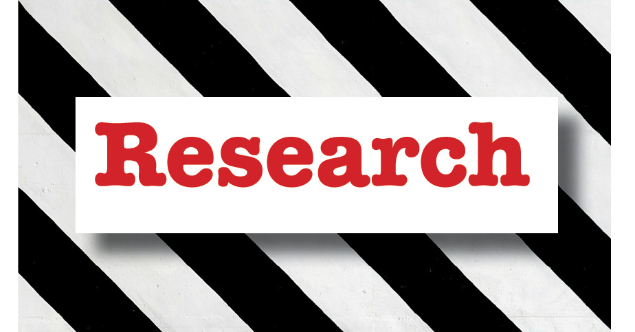 Modern research resource center with bold "Research" sign on black and white striped background, supporting student academic success and innovative learning.